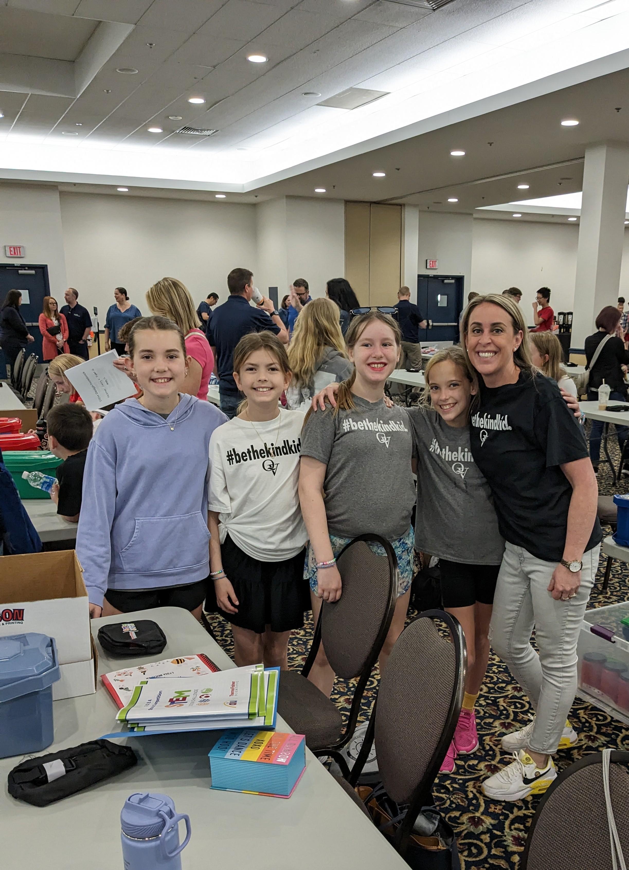 Image depicts members of the STEM Design team from Edgeworth Elementary posing with their coach, Mrs. Sara Schoener.